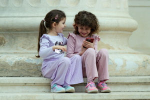 Two little girls amusing